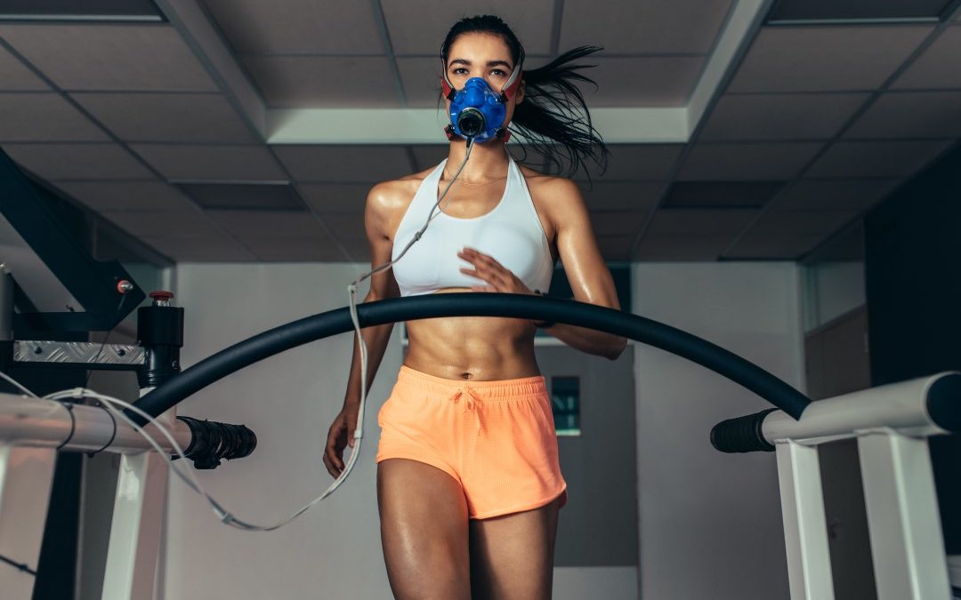 Female athlete on a running machine taking a VO2 max text